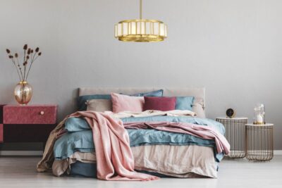 Fan de lier light fixture over bed