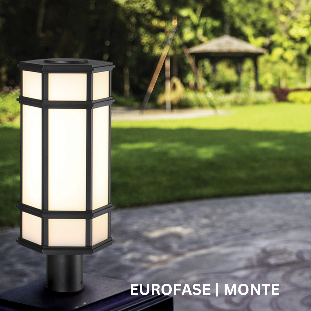 Hexagonal prism light mounted on a black post outside.