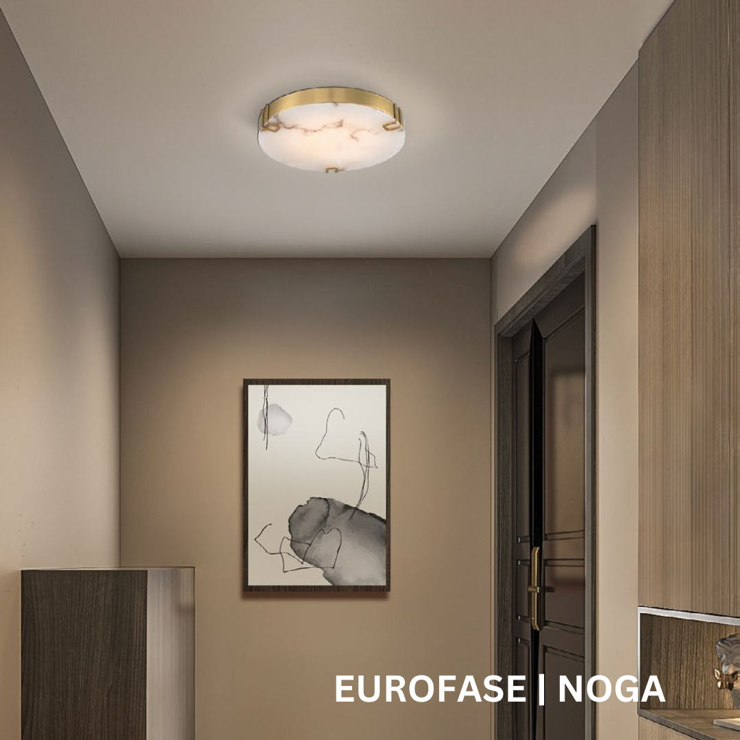 Shallow semi-flush mount light hanging from ceiling. The light has a gold band and white marble face.