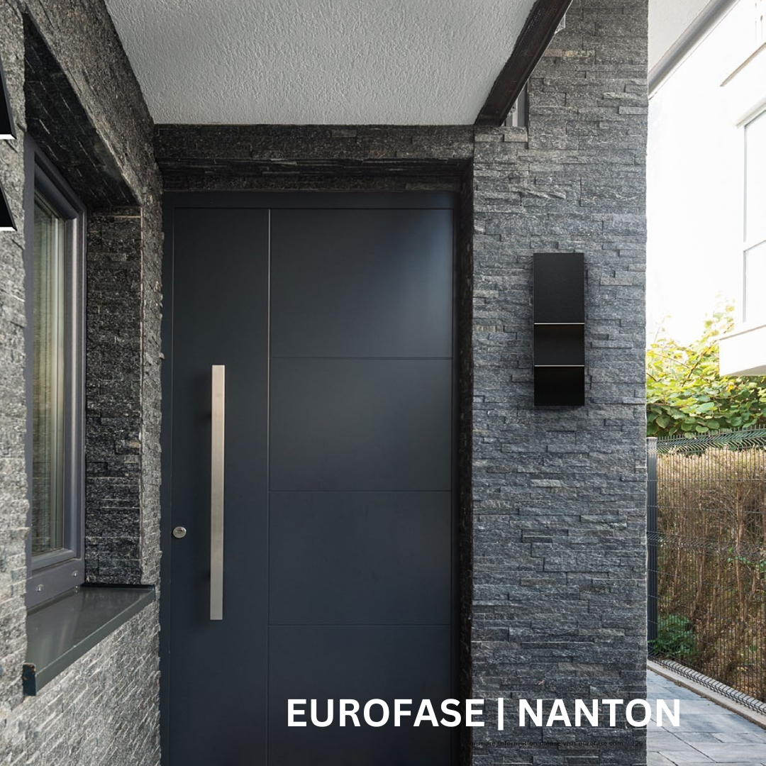 Black rectangular wall sconce next to a black exterior door.