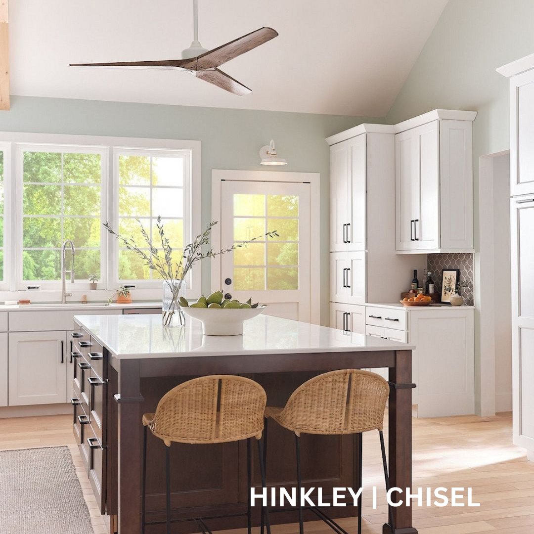 White kitchen with tri-blade fan hanging from the ceiling.