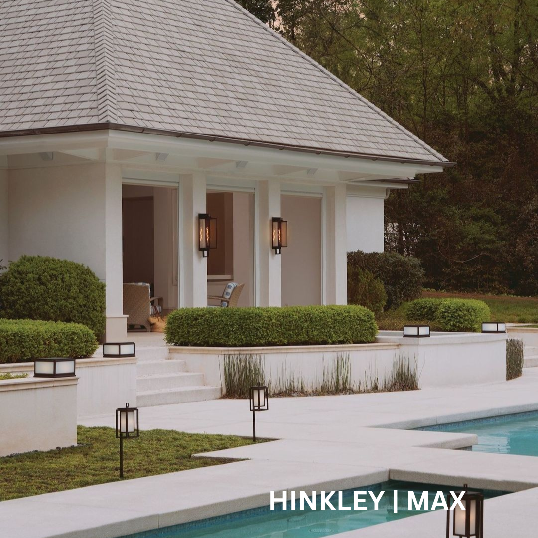 2 lanterns on 2 pillars of a pool house. 