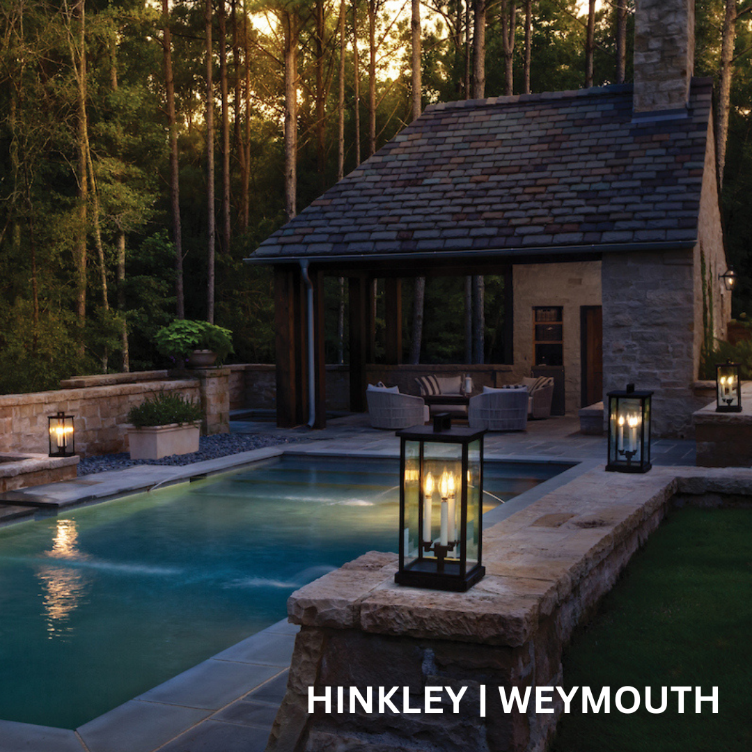 Rectangular lanterns spaced around a pool.