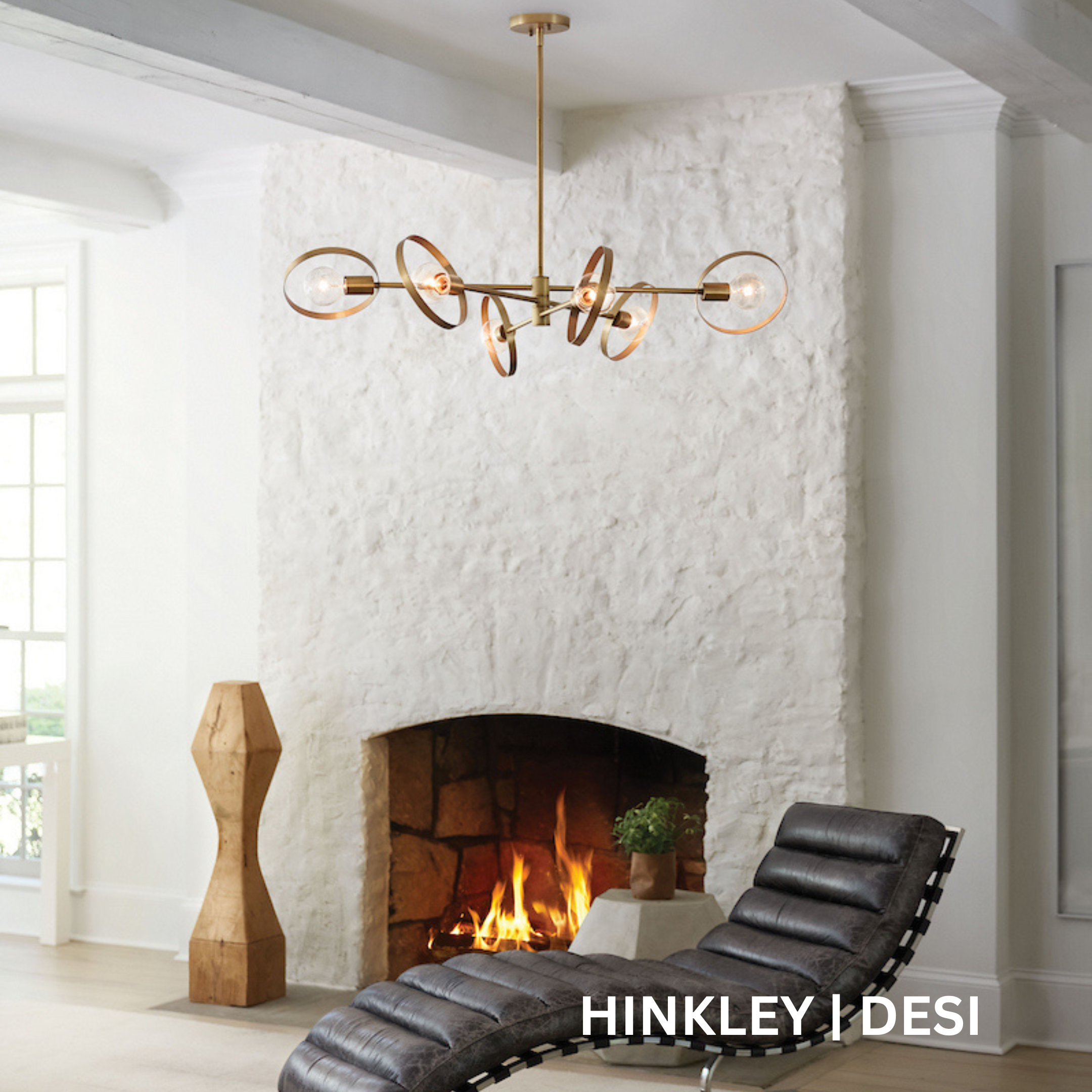 Multi-light fixture comprised of articulating arms with rings on the end.